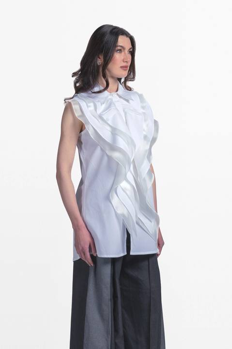 Sleeveless blouse with front ruffles.