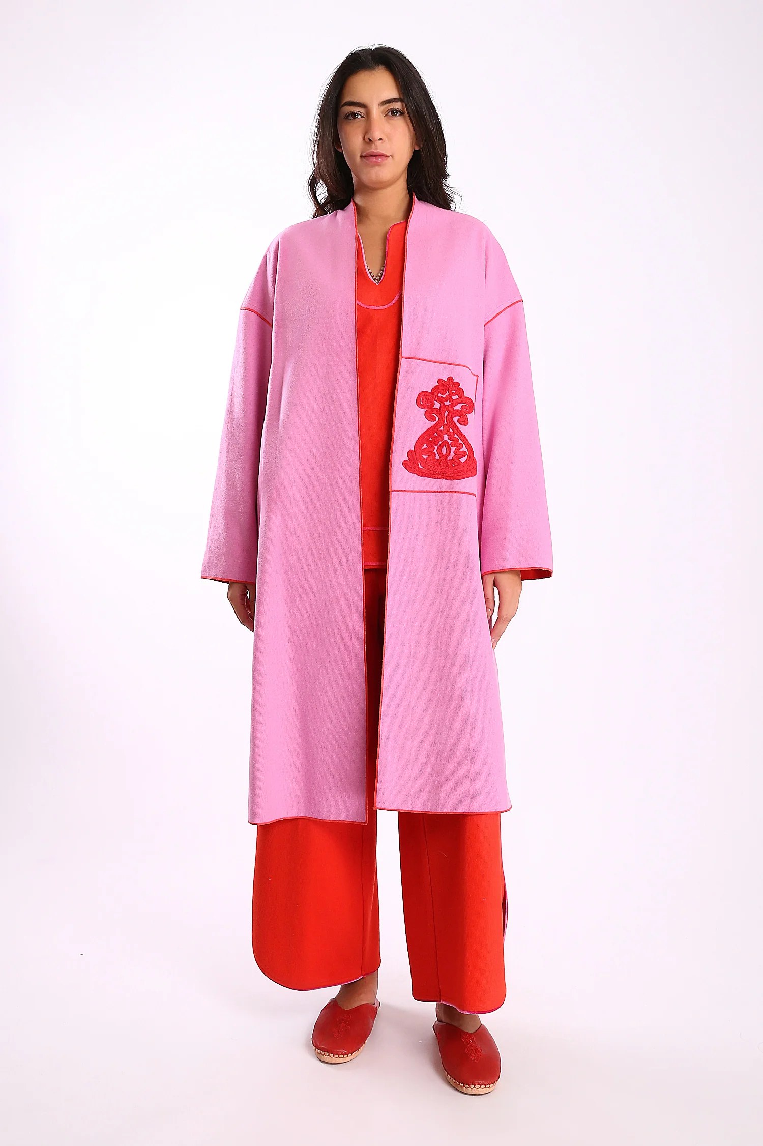 Reversible coat with front embroidered pocket