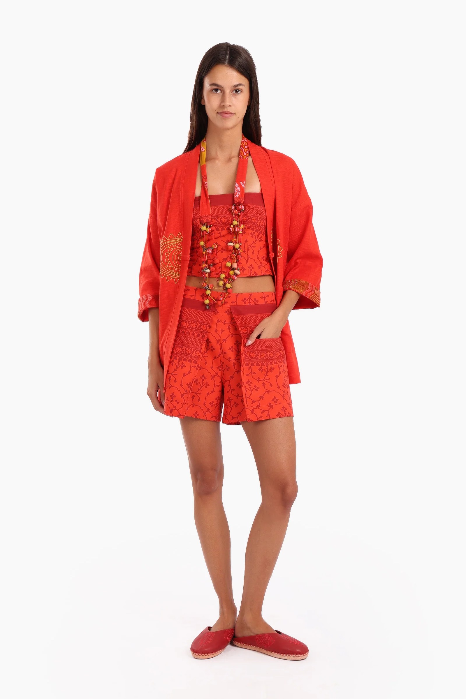 Shorts in printed cotton with front flaps