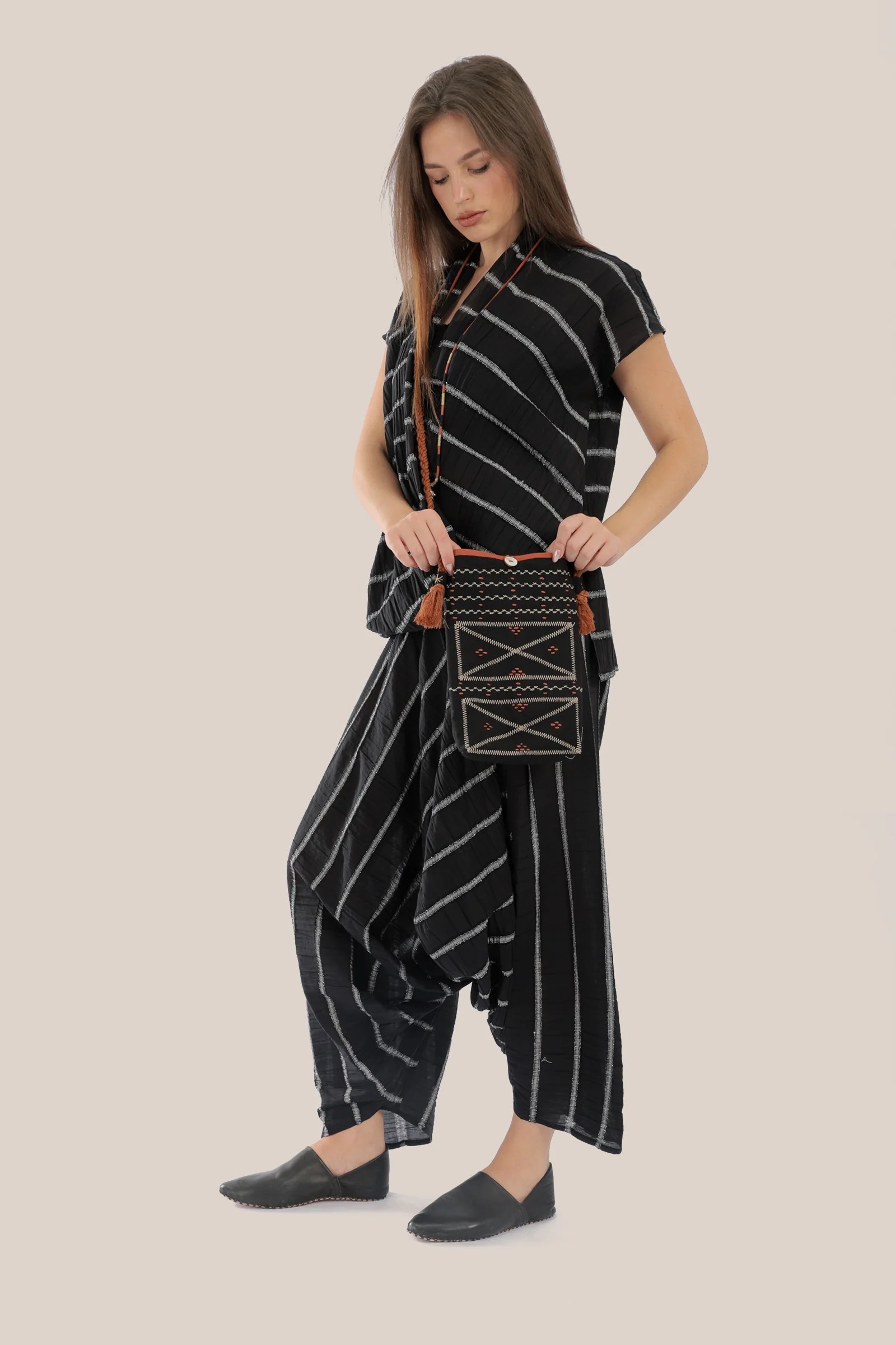 Sleeveless wrap top with crinkle striped and draped front