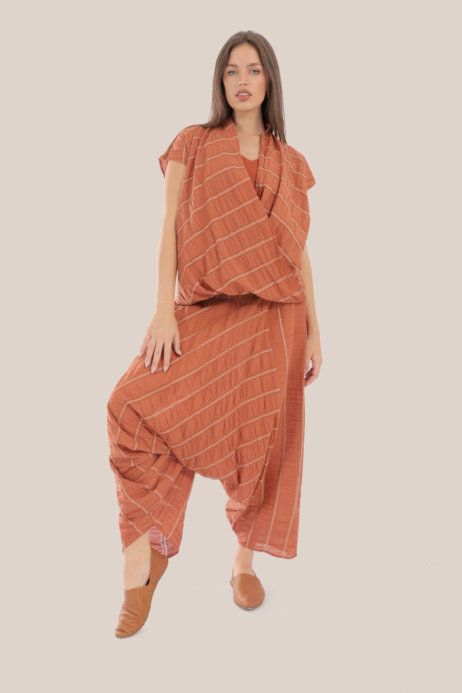 Sleeveless wrap top with crinkle striped and draped front