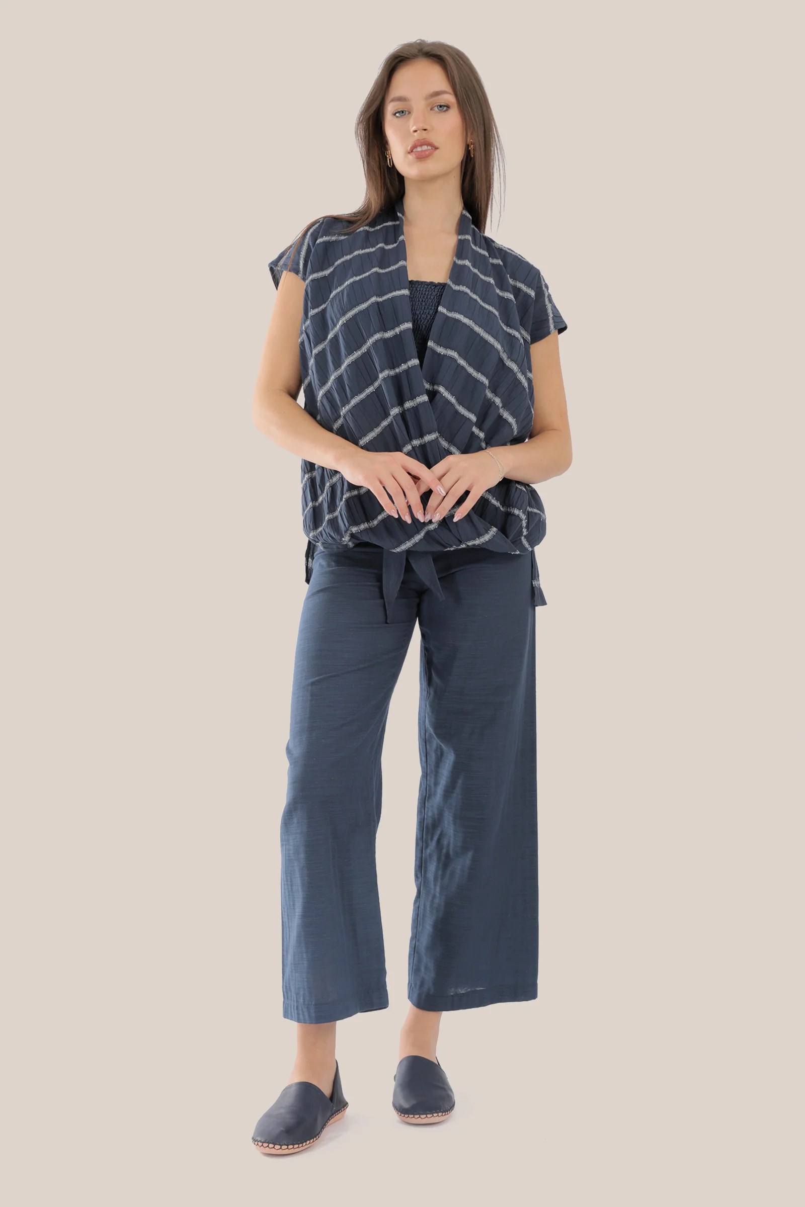 Sleeveless wrap top with crinkle striped and draped front