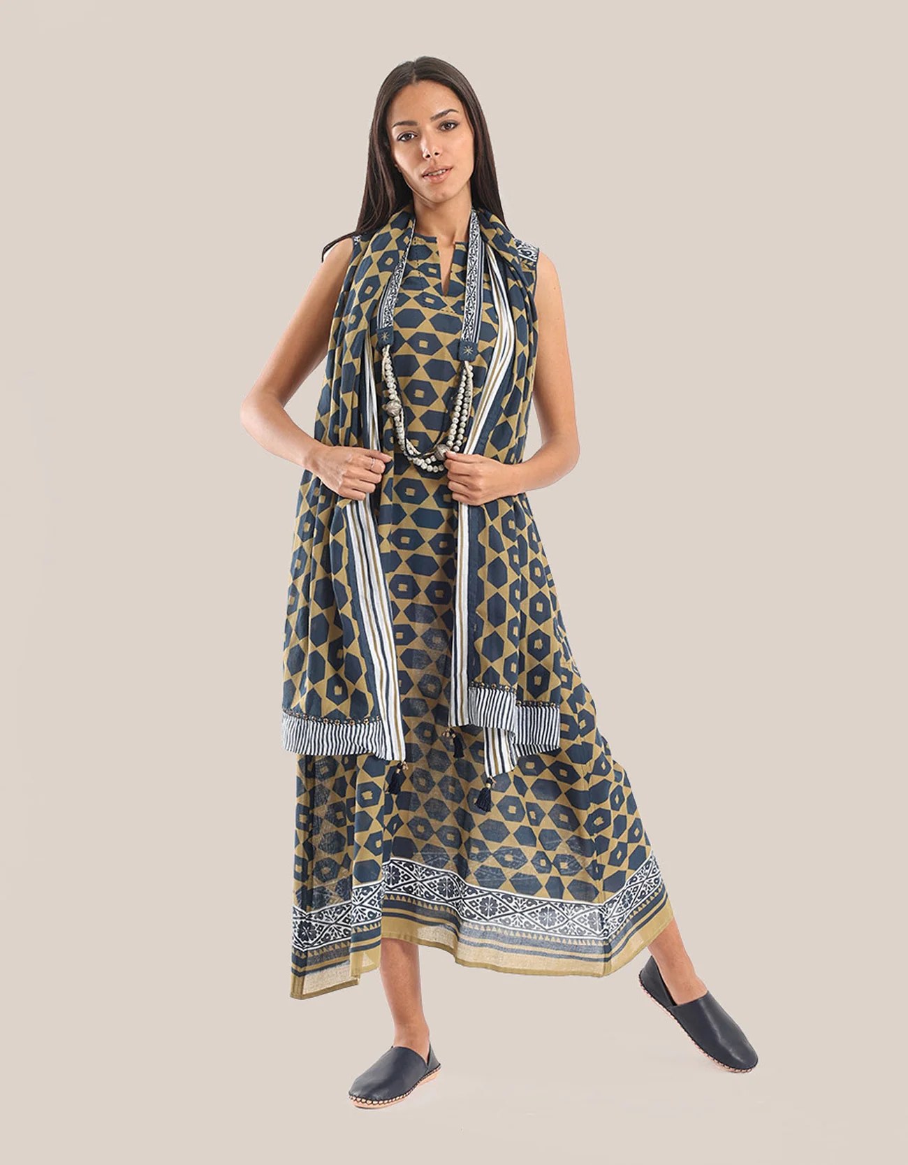 Sleeveless long dress with asymmetric hemline