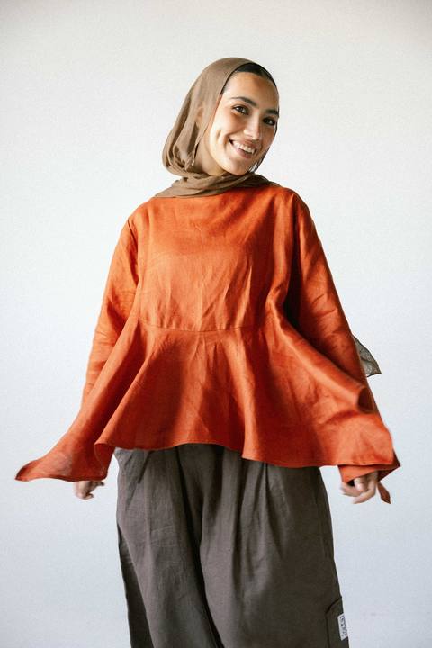 Ruffeled linen top in burnt-orange
